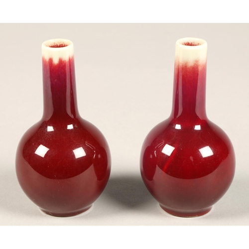 222 - Sang De Boeuf, pair of red bottle shaped chinese vases, 10 cm high