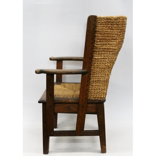 598 - Early 20th century oak framed Orkney chair, the woven back with scrolled arms and drop in woven seat... 