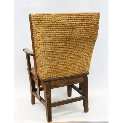 598 - Early 20th century oak framed Orkney chair, the woven back with scrolled arms and drop in woven seat... 