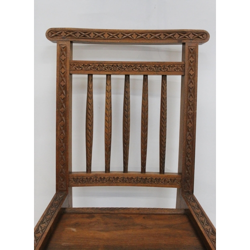 599 - Early 20th century Caithness chip carved Arts and Crafts crofters chair, H81cm.