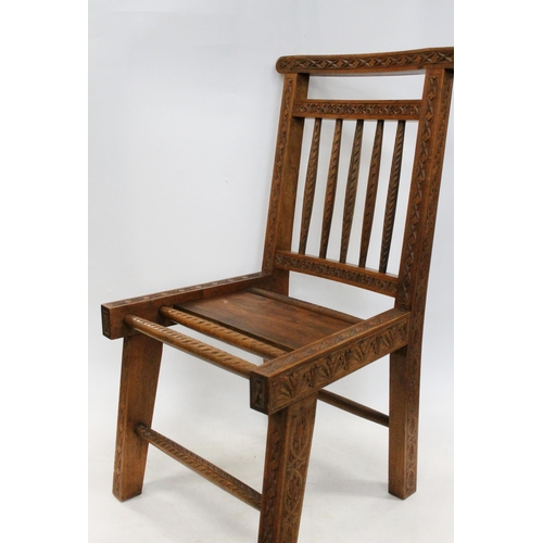 599 - Early 20th century Caithness chip carved Arts and Crafts crofters chair, H81cm.