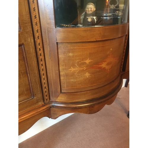 611 - Sheraton Revival mahogany and inlaid display cabinet, the ledgeback arch top above a central convex ... 