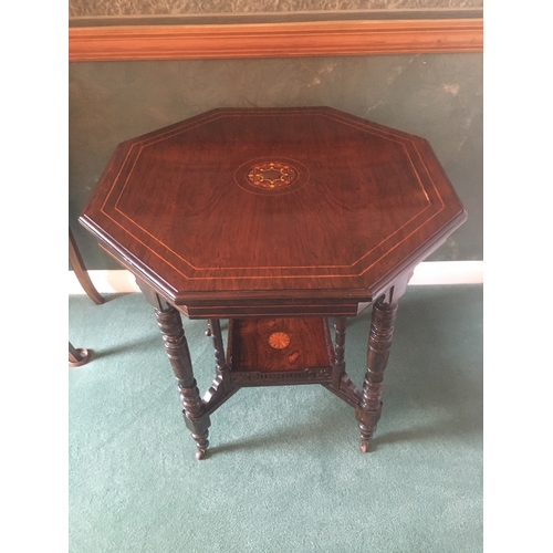 615 - Victorian rosewood and string inlaid octagonal centre table raised on eight turned supports united b... 