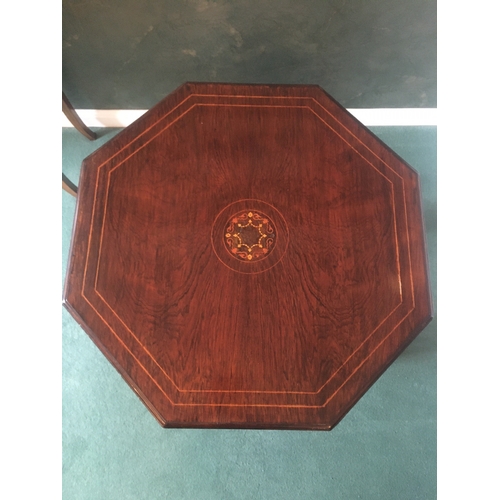 615 - Victorian rosewood and string inlaid octagonal centre table raised on eight turned supports united b... 