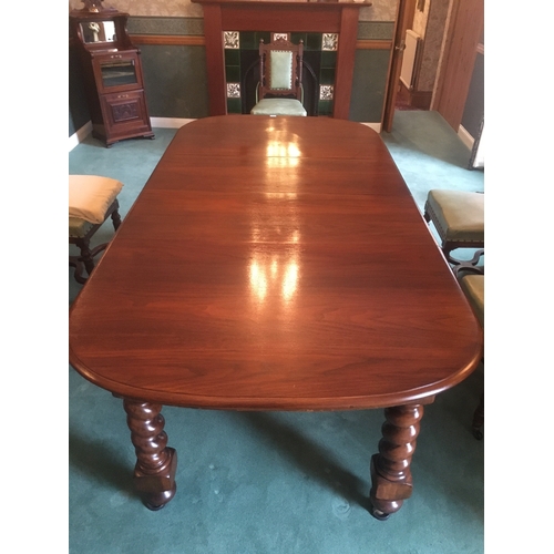 617 - Victorian mahogany telescopic extending dining table raised on large barley twist supports capped wi... 