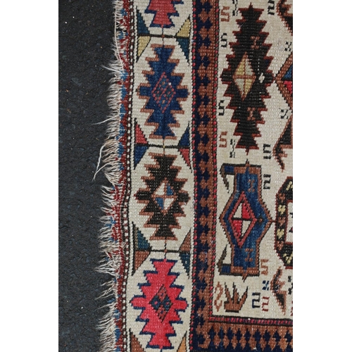 623 - Caucasian rug, the cream ground with polychrome geometric designs within conforming border, 140cm x ... 