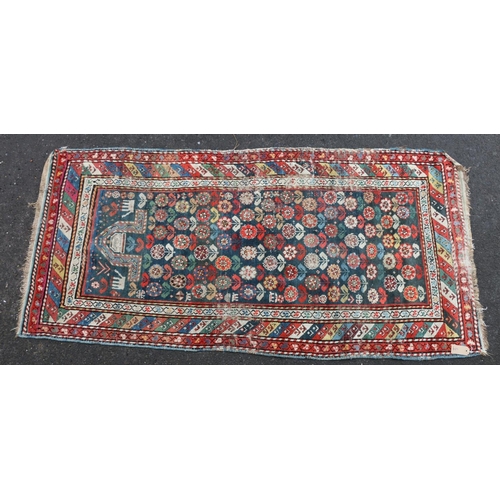 624 - Kazak Shirvan prayer rug or runner, the repeating polychrome flower motifs on blue ground within str... 