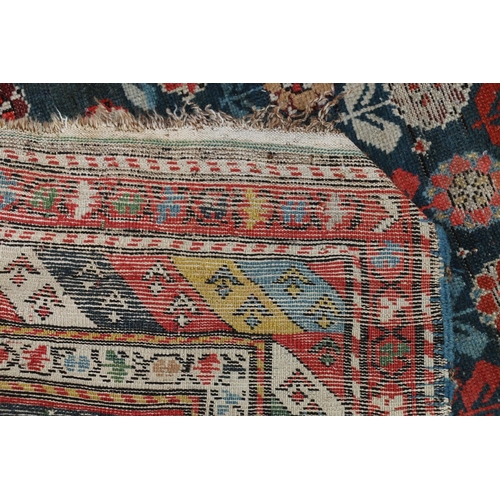 624 - Kazak Shirvan prayer rug or runner, the repeating polychrome flower motifs on blue ground within str... 