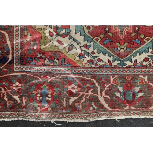 625 - Serapi carpet rug, decorated throughout with floral and foliate designs, the madder field within fol... 