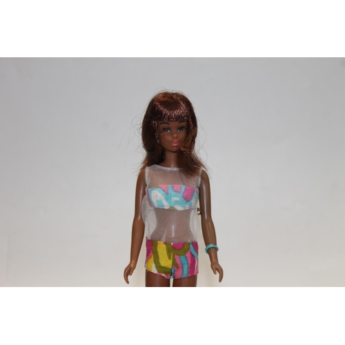 1083 - 1960s Mattel Inc Toymakers Barbie doll Barbie's Cousin Francie (1966) with brown skin tone, wearing ... 