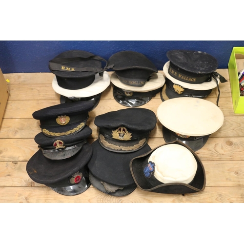 1548 - Five British Royal Navy black cloth peaked caps, one by Gieves Ltd, two sailors caps one with HMS WA... 