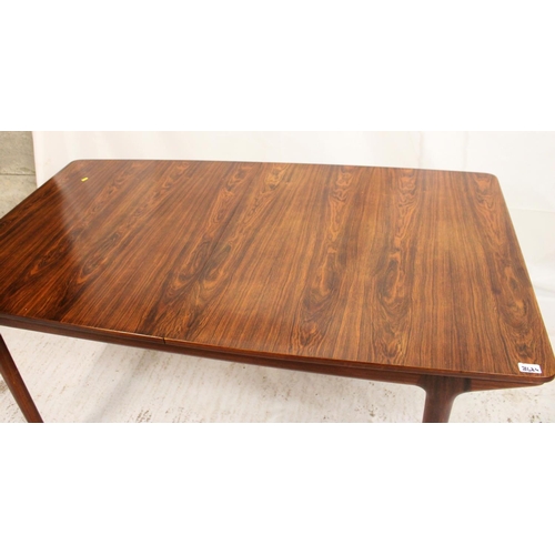 533 - AH McIntosh of Kirkcaldy, a 1960s rosewood extending rectangular top dining table on tapering suppor... 