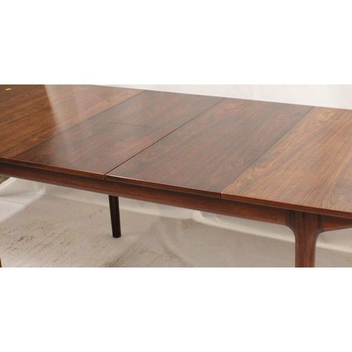533 - AH McIntosh of Kirkcaldy, a 1960s rosewood extending rectangular top dining table on tapering suppor... 