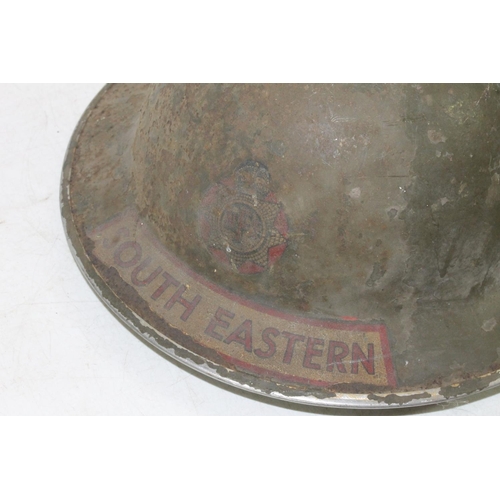 1545 - WWII era National Fire Service South Eastern helmet with NFS decal, having leather insert dated 1938... 