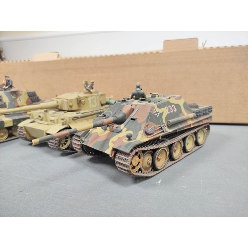 122 - Box of military model vehicles to include a German Tiger I tank, a King Tiger tank in field paint, C... 