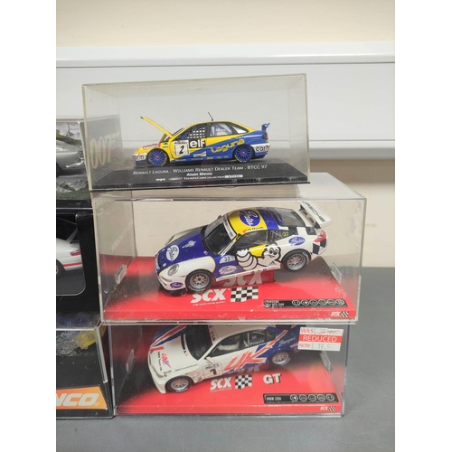 126 - Collection of model racing cars to include a SCX Porsche 911 GT3 Cup 64680, Ninco Porsche 997 GT3 50... 