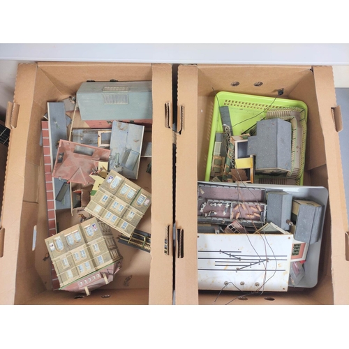 305 - Two boxes of model railway buildings to include some examples by Will's Finecast and comprising of a... 