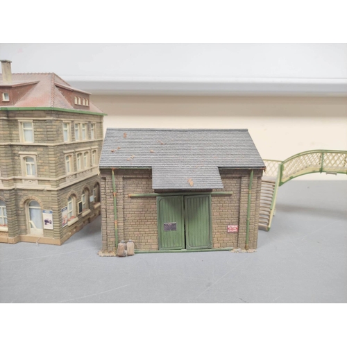 305 - Two boxes of model railway buildings to include some examples by Will's Finecast and comprising of a... 