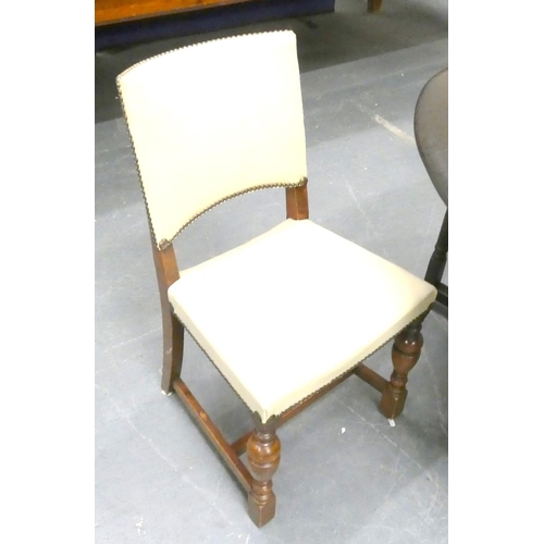 370 - Four vintage oak dining chairs with cream leather pads.