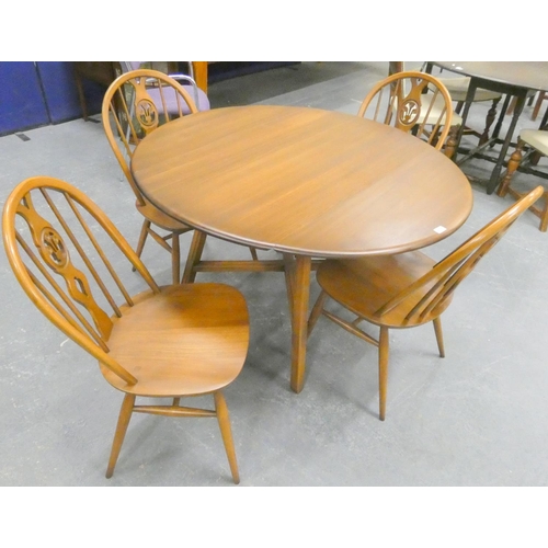 374 - Ercol dining table and four Windsor style chairs. (5)