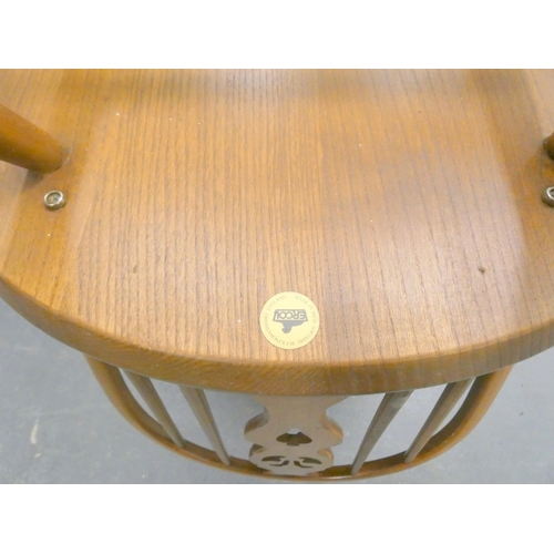 374 - Ercol dining table and four Windsor style chairs. (5)