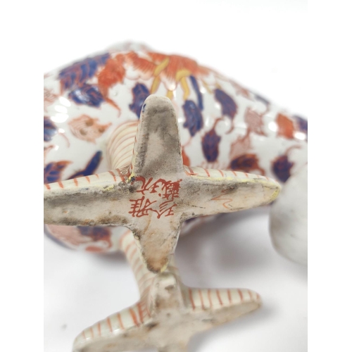 393 - Japanese Meiji period imari gu shaped vase in the form of a mythical bird, Decorated with carnations... 