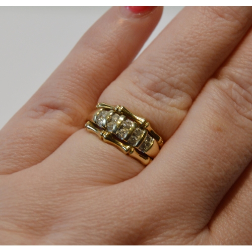 88 - Diamond ring set with ten small brilliants, paired in 9ct gold, size O/P, 3.4g gross.