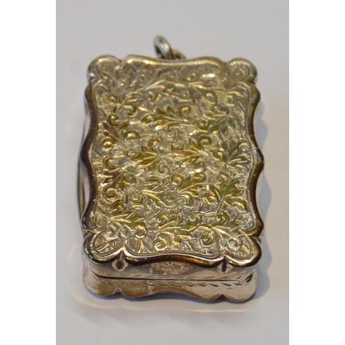 14 - Victorian engraved silver vinaigrette with pendant, Birmingham 1884, 35mm x 25mm.