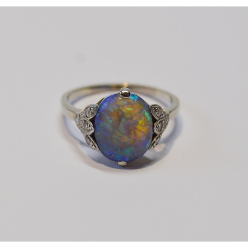 94 - Art Deco period black opal and diamond ring, the cabochon approximately 10mm x 8mm, in trefoil shoul... 