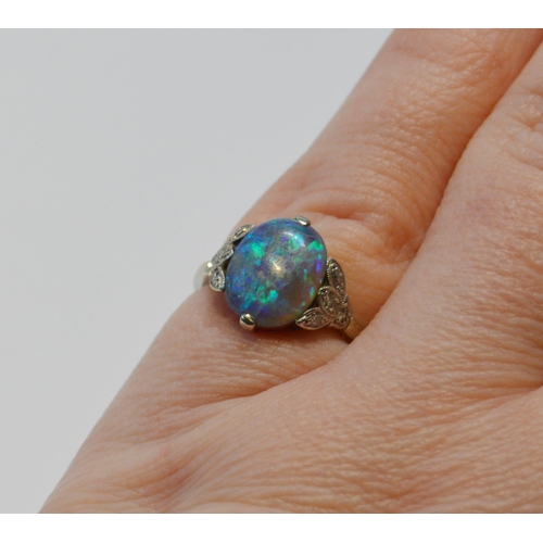 94 - Art Deco period black opal and diamond ring, the cabochon approximately 10mm x 8mm, in trefoil shoul... 