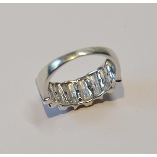 97 - Diamond half eternity-style ring with twenty-one diamonds, in 9ct white gold, size Q, 4.3g gross.