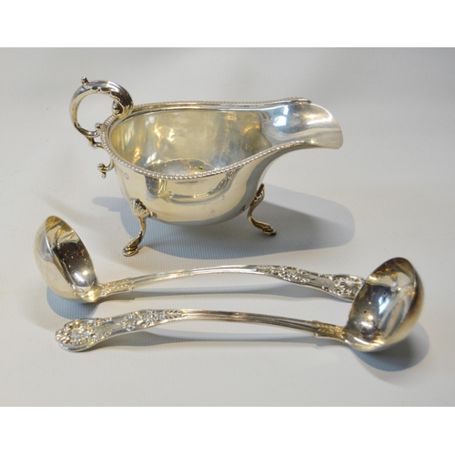 35 - Pair of silver toddy ladles of Queen's pattern, Glasgow 1861, and a silver sauce boat, 1935, 183g or... 