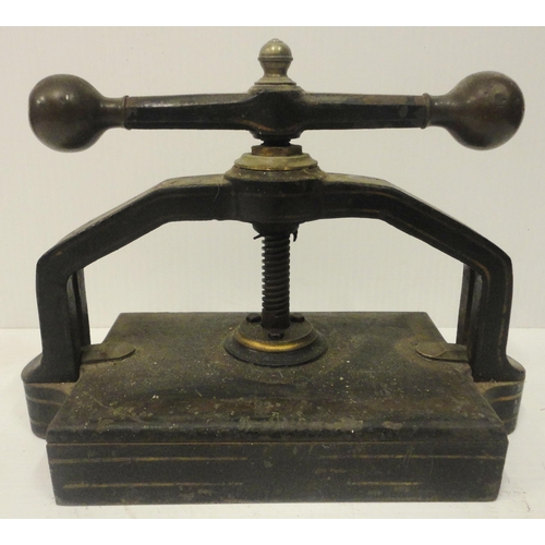 207 - Victorian cast iron book press, with lion seal mark to the underside, 41cm high and 52cm wide.