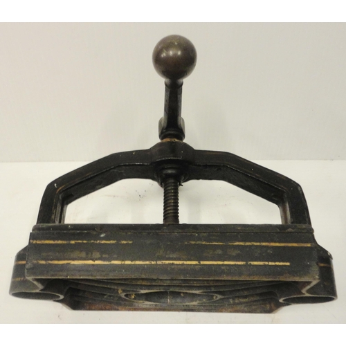 207 - Victorian cast iron book press, with lion seal mark to the underside, 41cm high and 52cm wide.