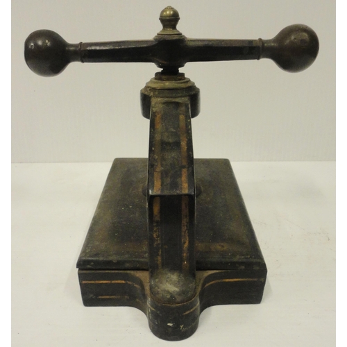 207 - Victorian cast iron book press, with lion seal mark to the underside, 41cm high and 52cm wide.