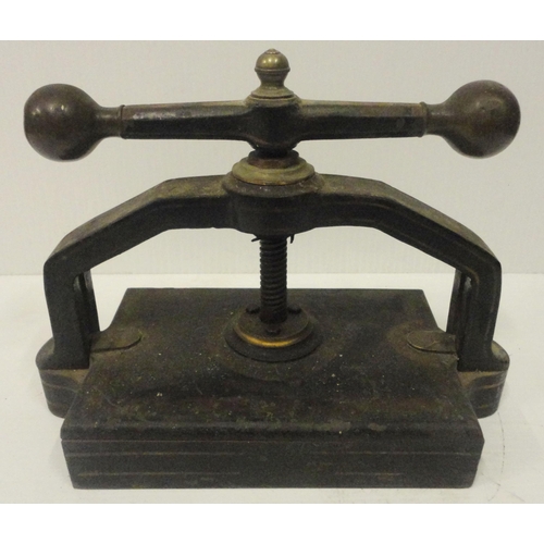 207 - Victorian cast iron book press, with lion seal mark to the underside, 41cm high and 52cm wide.