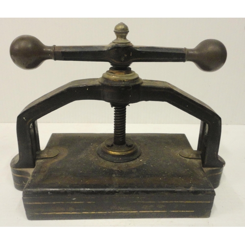 207 - Victorian cast iron book press, with lion seal mark to the underside, 41cm high and 52cm wide.