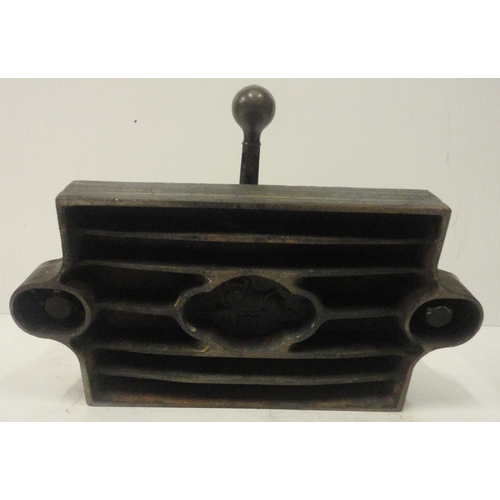 207 - Victorian cast iron book press, with lion seal mark to the underside, 41cm high and 52cm wide.