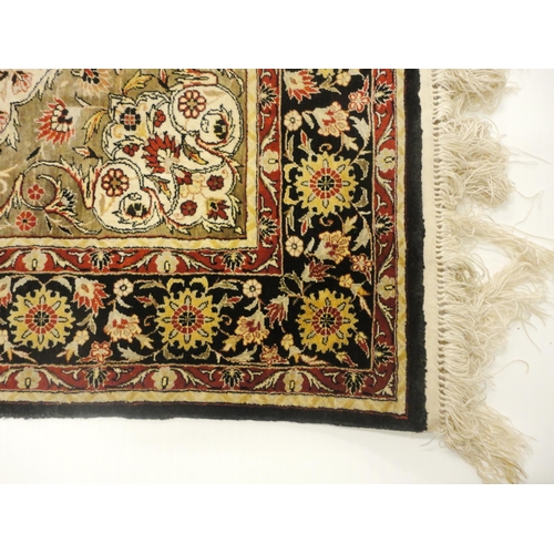 384 - Kashmir silk rug with foliate medallion to the centre, on cream, red and blue field within all over ... 