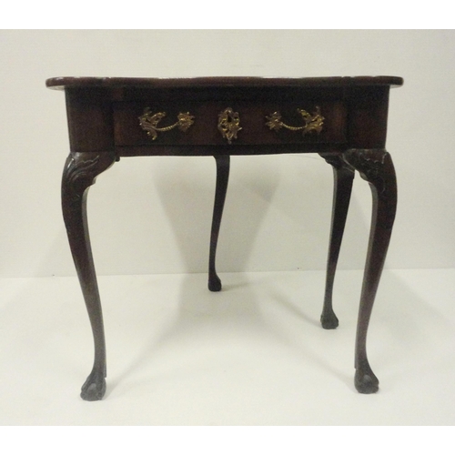 412 - George II style mahogany fold-over card table, on twin gate supports with central drawer, on ball an... 