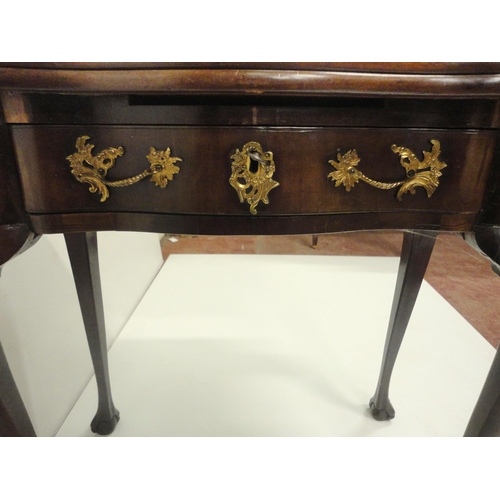 412 - George II style mahogany fold-over card table, on twin gate supports with central drawer, on ball an... 