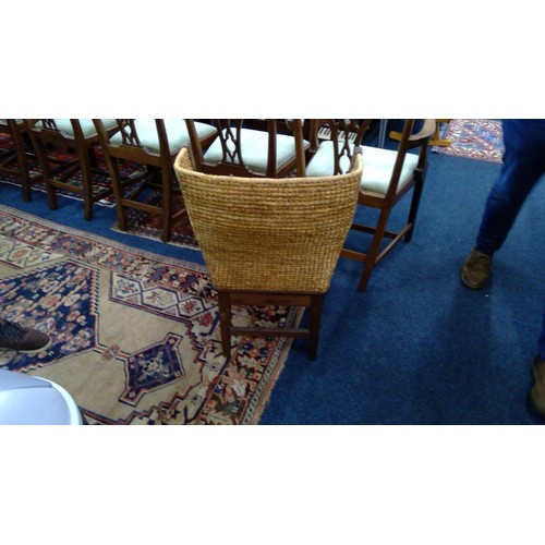 598 - Early 20th century oak framed Orkney chair, the woven back with scrolled arms and drop in woven seat... 