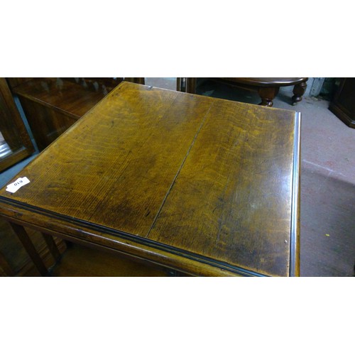 610 - Early 20th century oak revolving bookcase of typical form, 114cm tall.