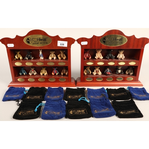 Nineteen miniature Steiff bears, with bags on two miniature display shelves