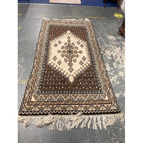 507 - Persian design brown and white rug.