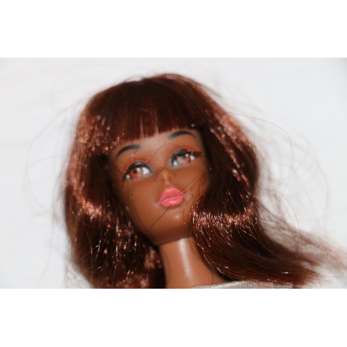 1083 - 1960s Mattel Inc Toymakers Barbie doll Barbie's Cousin Francie (1966) with brown skin tone, wearing ... 