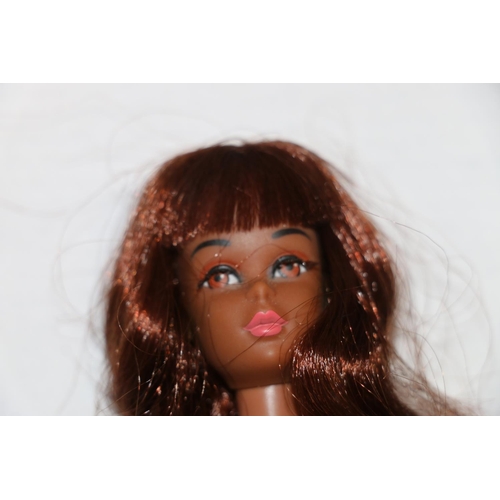 1083 - 1960s Mattel Inc Toymakers Barbie doll Barbie's Cousin Francie (1966) with brown skin tone, wearing ... 