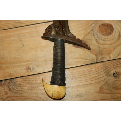1553 - Malaysian kris with typical ornate flamberge blade, white metal wire bound grip and ivory birds head... 