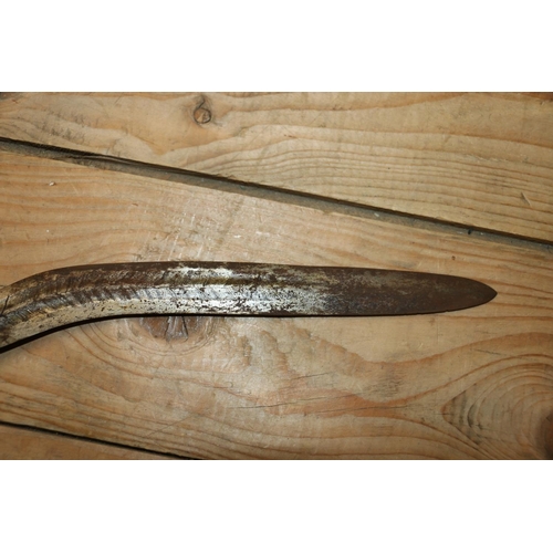 1553 - Malaysian kris with typical ornate flamberge blade, white metal wire bound grip and ivory birds head... 