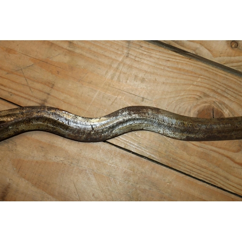 1553 - Malaysian kris with typical ornate flamberge blade, white metal wire bound grip and ivory birds head... 